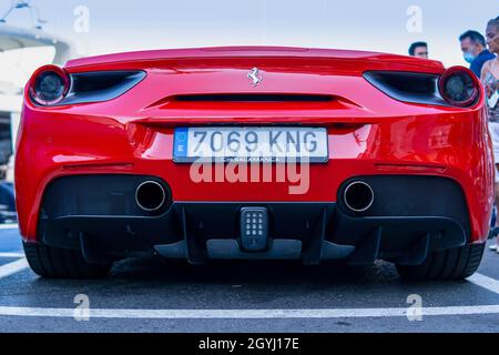 PUERTO BANUS MALAGA, SPAIN - Aug 19, 2021: Puerto Banus, Spain: August 19 2021: Close up Rear view of a red modern sport car Ferrari parked at the mar Stockfoto