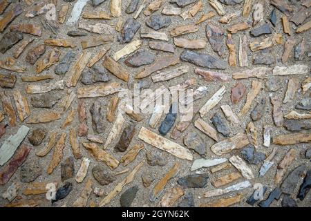 Alten Stil Kopfsteinpflaster in den Entranceof der Perk Güell in Barcelona als Hintergrund. Stockfoto