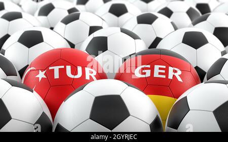 Türkei gegen Deutschland Fußballspiel - Lederkugeln in der Türkei und deutschen Nationalfarben. 3D-Rendering Stockfoto