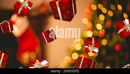 Bild von Geschenken, die über den weihnachtsbaum fallen Stockfoto