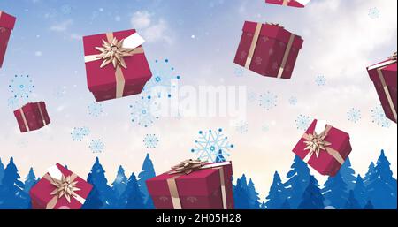 Bild von weihnachtsgeschenken und Schnee fällt über die Winterlandschaft Stockfoto