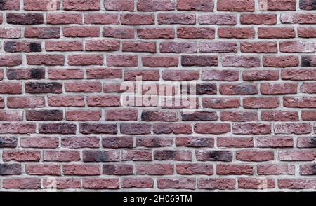 Nahtlose Textur der dunkelroten Ziegelwand. Altes Mauerwerk. Stockfoto