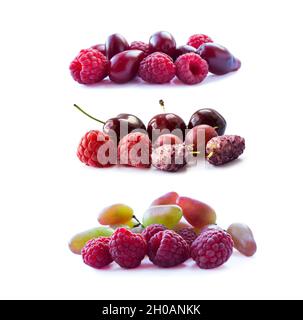 Rosa Beeren isoliert auf weißem Hintergrund. Reife Himbeeren, Kirschen, Maulbeeren, Stachelbeeren und Trauben. Hintergrund der Mischung Beeren mit Kopierer Platz Stockfoto