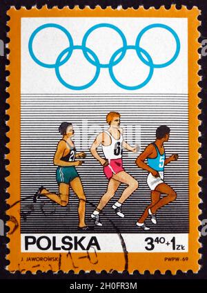 POLEN - UM 1969: Eine in Polen gedruckte Briefmarke zeigt Running, Olympic Sport, um 1969 Stockfoto