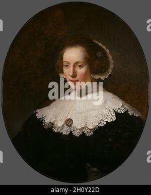 Porträt einer Frau, 1635 oder früher. Rembrandt van Rijn (Niederländisch, 1606-1669) und Studio. Öl auf Holz; gerahmt: 97.8 x 83.8 x 6.4 cm (38 1/2 x 33 x 2 1/2 Zoll); ungerahmt: 77.5 x 64.8 cm (30 1/2 x 25 1/2 Zoll). Im Alter von 25 Jahren zog Rembrandt von seiner Heimatstadt Leiden in die geschäftige Stadt Amsterdam. Innerhalb weniger Jahre war er zu einem der erfolgreichsten Porträtmaler der Stadt geworden und schuf bemerkenswert lebendige Bilder, die die Persönlichkeit und Seele des Sitters auszudrücken schienen. Hier verwendete Rembrandt sanfte, flüssige Pinselstriche, um die weiche Textur der Haut der Frau nachzubilden. Im Gegensatz dazu Stockfoto