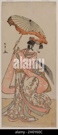 Der Schauspieler Segawa Kikunojo II Tanzen mit einem Sonnenschirm, Ende der 1770er Jahre. Katsukawa Shunshō (Japanisch, 1726-1792). Farbholzschnitt; Bild: 33.3 x 14.6 cm (13 1/8 x 5 3/4 Zoll). Die Robe der Tänzerin ist mit den Wappen von drei Kabuki-Schauspielern geschmückt: Ichimura Uzaemon IX, Nakamura Nakazo I und Nakamura Tomijuro I. Stockfoto