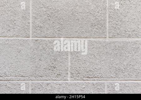 Foto Textur der grauen Beton Ziegel Stuckwand. Stockfoto