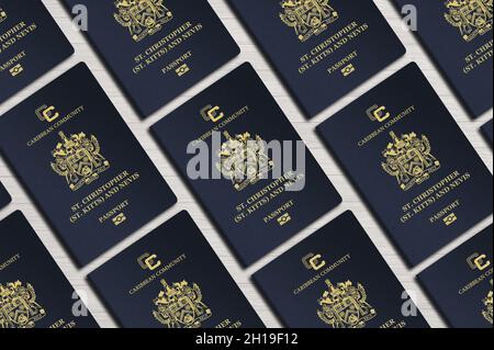 Pässe des karibischen Staates St. Kitts und Nevis, Draufsicht, auf einem Holztisch Stockfoto