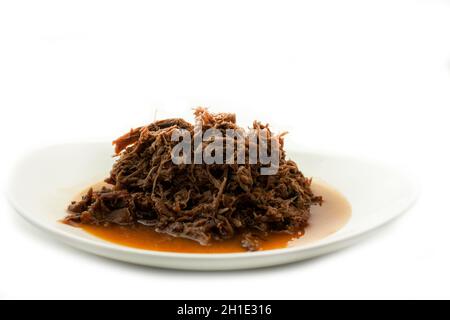 Lamm bereit, für die Weihnachtsferien gewürzt mit Chili und Knoblauch in Mexiko isoliert auf weißem Hintergrund zu essen Stockfoto