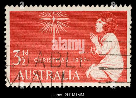 Die in Australien aus der Weihnachtsausgabe gedruckte Briefmarke zeigt The Spirit of Christmas, um 1957. Stockfoto