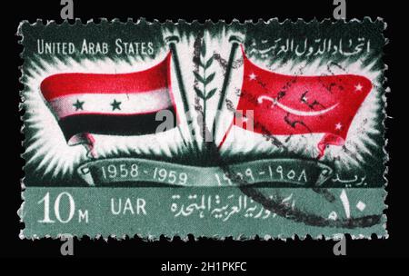 Briefmarke gedruckt in Ägypten zeigt Flaggen der U.A.R. und Jemen, 1. Jahrestag der Proklamation der Vereinigten Arabischen Staaten, um 1959 Stockfoto