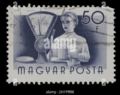 Briefmarke gedruckt in Ungarn, zeigt Verkäufer, Serie Berufe, um 1955 Stockfoto