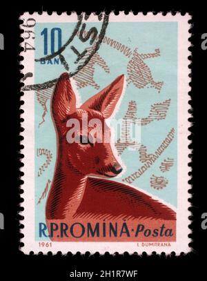 Zeigen Sie Stempel von Rumänien, gedruckt Rehe und Bronzezeit Jagdszene, ca. 1961. Stockfoto