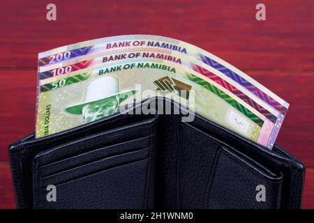 Namibischer Dollar in der schwarzen Brieftasche Stockfoto