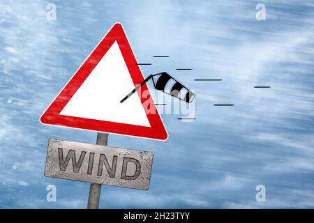 Windwarnschild, das von einem Sturm weggeblasen wird Stockfoto