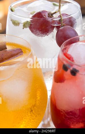 colored alcoholic beverages served in three glasses Stockfoto
