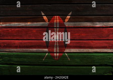 3D-Flagge Kenias auf einem alten Holzwandhintergrund. Stockfoto