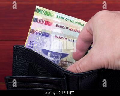 Namibischer Dollar in der schwarzen Brieftasche Stockfoto