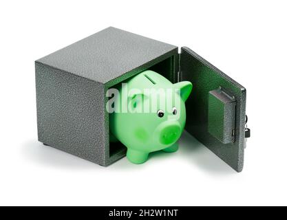 Grüne Keramik Sparschwein in einem Safe Stockfoto
