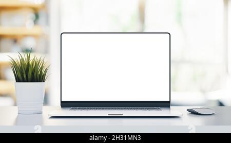 Moderner Laptop-PC mit rahmenlosem leerem Bildschirm auf weißem Holztisch in der Inneneinrichtung - Modell-Vorlage Stockfoto