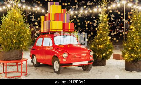 Weihnachten roten Retro-Auto mit Geschenkboxen auf dem Dach Nahaufnahme vor dem Hintergrund des Nachthimmels mit Bokeh. Vintage roten LKW mit Geschenken umgeben Stockfoto