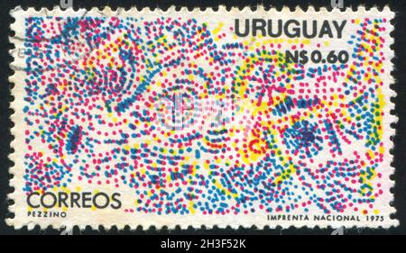 URUGUAY - UM 1975: Briefmarke gedruckt von Uruguay, zeigt Weihnachtsfeuerwerk, um 1975 Stockfoto