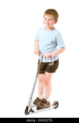 Kleiner Junge auf dem Roller Stockfoto