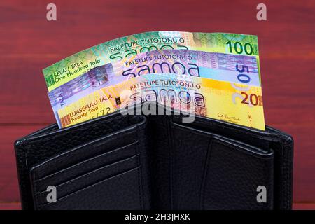 Samoan Money - Tala in der schwarzen Brieftasche Stockfoto