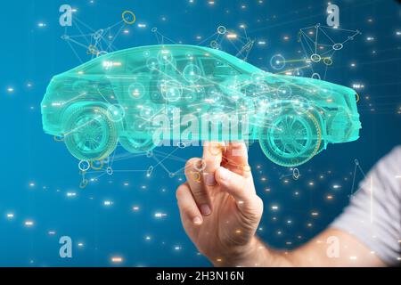 3D-gerendertes Hologramm eines Autos mit einer Hand, die vom Hintergrund auf das Fahrzeug zeigt Stockfoto