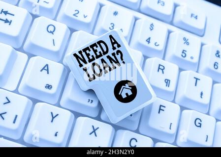 Schreiben von angezeigten Text benötigt Eine Kreditfrage. Wort für die Frage, er braucht Geld erwartet zurückgezahlt mit Zinsen Eingabe New Edition von Informations-eBook Stockfoto