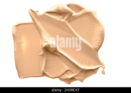 Beige kosmetische Textur isoliert auf weißem Hintergrund, verschmiert Make-up Emulsion Creme Abstrich oder Foundation Abstrich, zerkleinert CO Stockfoto