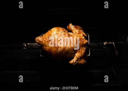 Huhn auf Rotisserie Stockfoto