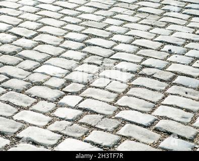 Straße gepflastert mit Pflastersteinen für Ihren Hintergrund Stockfoto