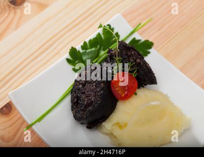 Morcilla Blutwurst mit Reis Stockfoto