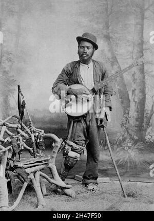 Ein schwarzer Banjo-Spieler mit einem Holzbein. Foto, ca. 1865 (?). Stockfoto