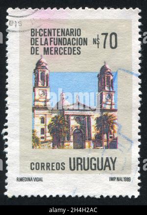 URUGUAY - UM 1990: Briefmarke gedruckt von Uruguay, zeigt die Stadt Mercedes, um 1990 Stockfoto