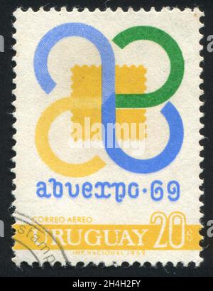 URUGUAY - UM 1969: Briefmarke gedruckt von Uruguay, zeigt Ausstellungs-Emblem, um 1969 Stockfoto