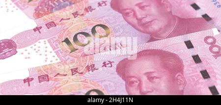 Chinesischer Yuan Renminbi Rechnung Banknoten Hintergrund. Mao-Präsident Porträt über die chinesische Papierwährung 100, Nahaufnahme. Banken und Finanzen Stockfoto
