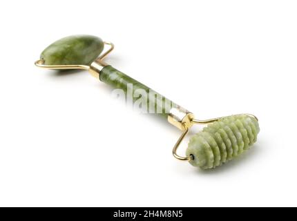 Greenstone, Nephrit Gesichtsmassagegerät isoliert auf weißem Hintergrund Stockfoto