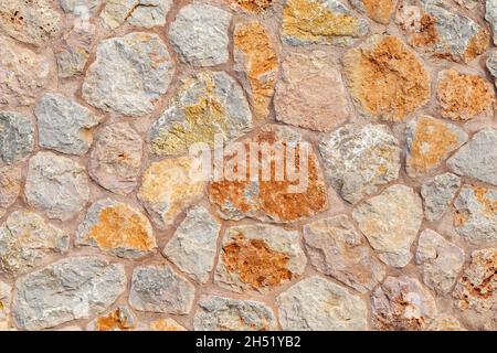 Textur Muster Hintergrund der bunten außen naural Steinwand Stockfoto