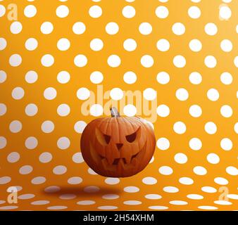Geschnitzter Halloween Kürbis auf orangefarbenem Hintergrund mit Tupfen. Stockfoto