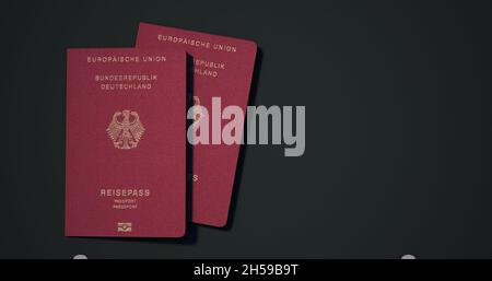 Deutschland-Pass. Reisepass aus verschiedenen Ländern mit dunklem Hintergrund 3d-Rendering. Stockfoto