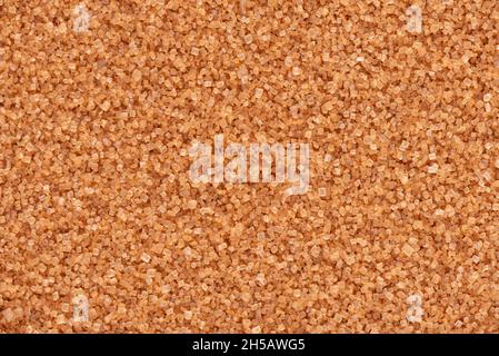 Brauner Zuckerhintergrund. Textur der Zuckerrohrkristalle. Stockfoto