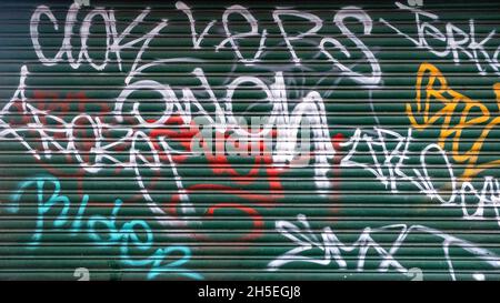 Kingston upon Thames London England UK November 5 2021, Graffiti Painted on A Green Metal Security Shutter With No People Stockfoto