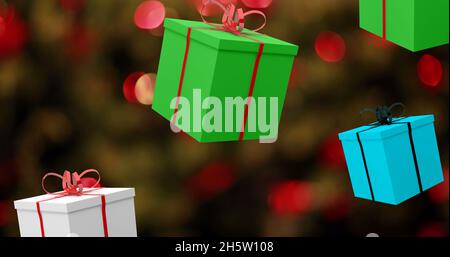 Bild von Geschenken, die zu weihnachten über Lichterketten fallen Stockfoto