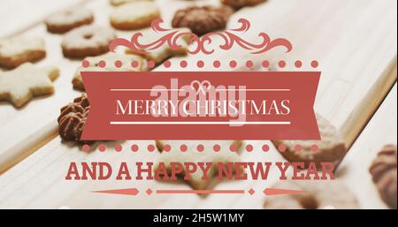 Bild von fröhlichem weihnachtstext über Cookies Stockfoto