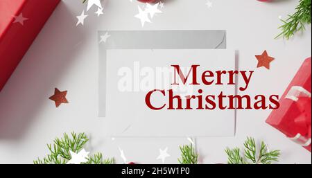 Bild von fröhlichem weihnachtstext über Sternen Stockfoto