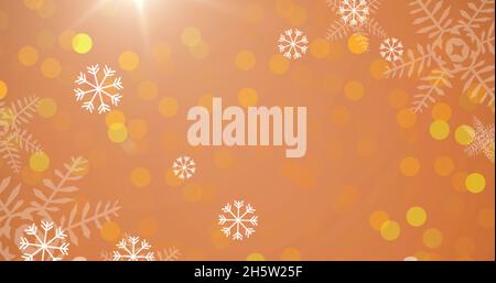 Bild von Schnee fällt zu weihnachten auf orangefarbenem Hintergrund Stockfoto