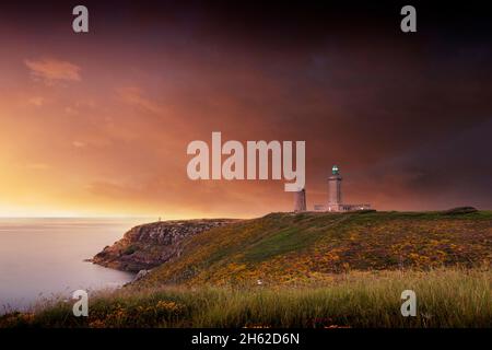 Cap fréhel, Leuchtturm in der bretagne bei Sonnenuntergang Stockfoto