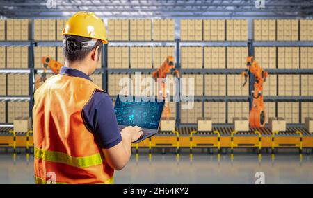 Techniker steuern 3d-Rendering-Automatisierungsroboter im Werk Stockfoto